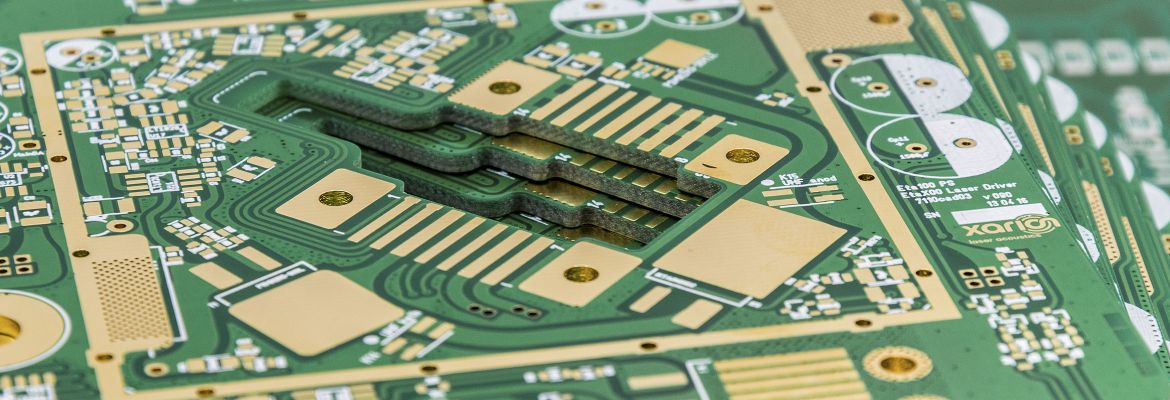 Close-up of a green printed circuit board (PCB) from XARION's electronics manufacturing