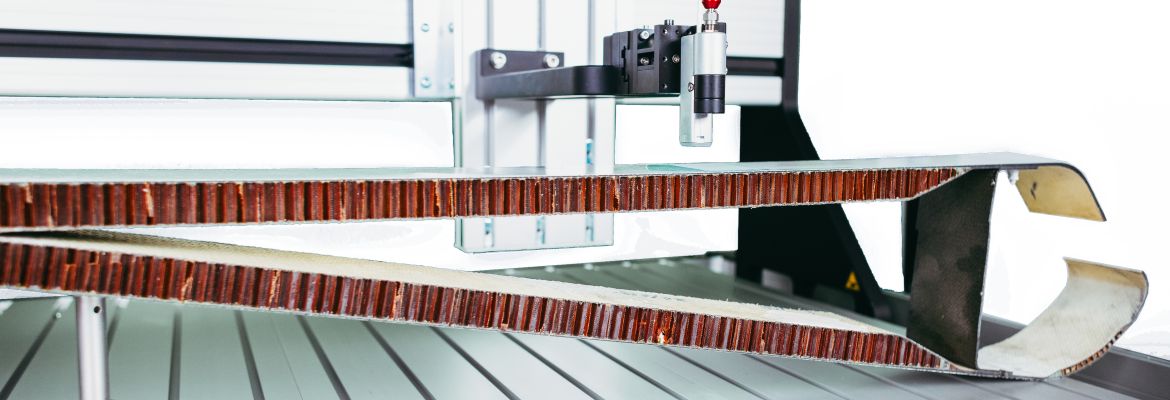 XARION scanner head inspecting a honeycomb composite panel for delamination and porosity